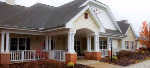 Brookdale Austintown exterior with covered entrance, white columns, and brick base.