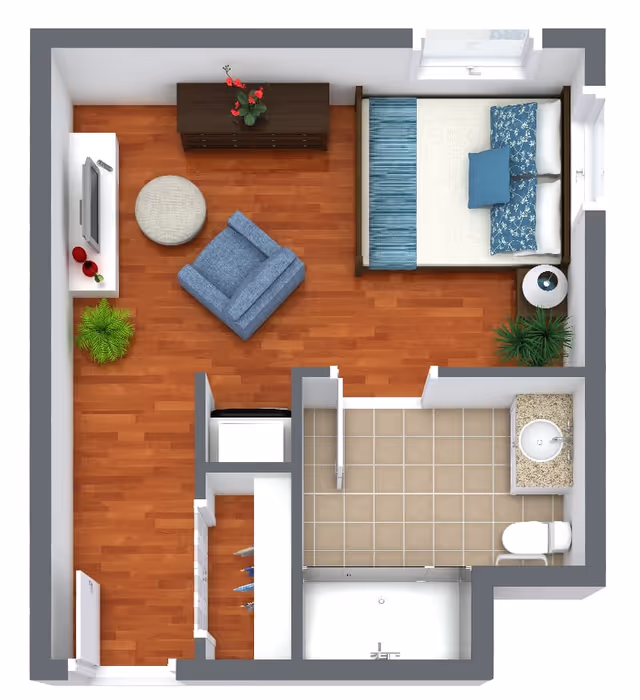 Top-down view of a senior living facility studio apartment floor plan featuring a combined living and sleeping area with a bed, armchair, TV, and plants. The apartment includes a bathroom with a sink, toilet, and shower, and a small closet near the entrance.