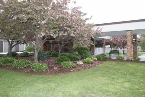 Exterior view of Absolut Care of Westfield with landscaped front lawn and entrance.