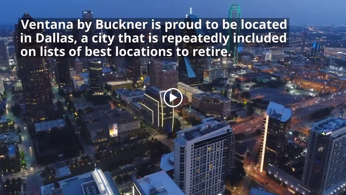Aerial nighttime view of downtown Dallas skyline with overlay text promoting Ventana by Buckner and a play button.