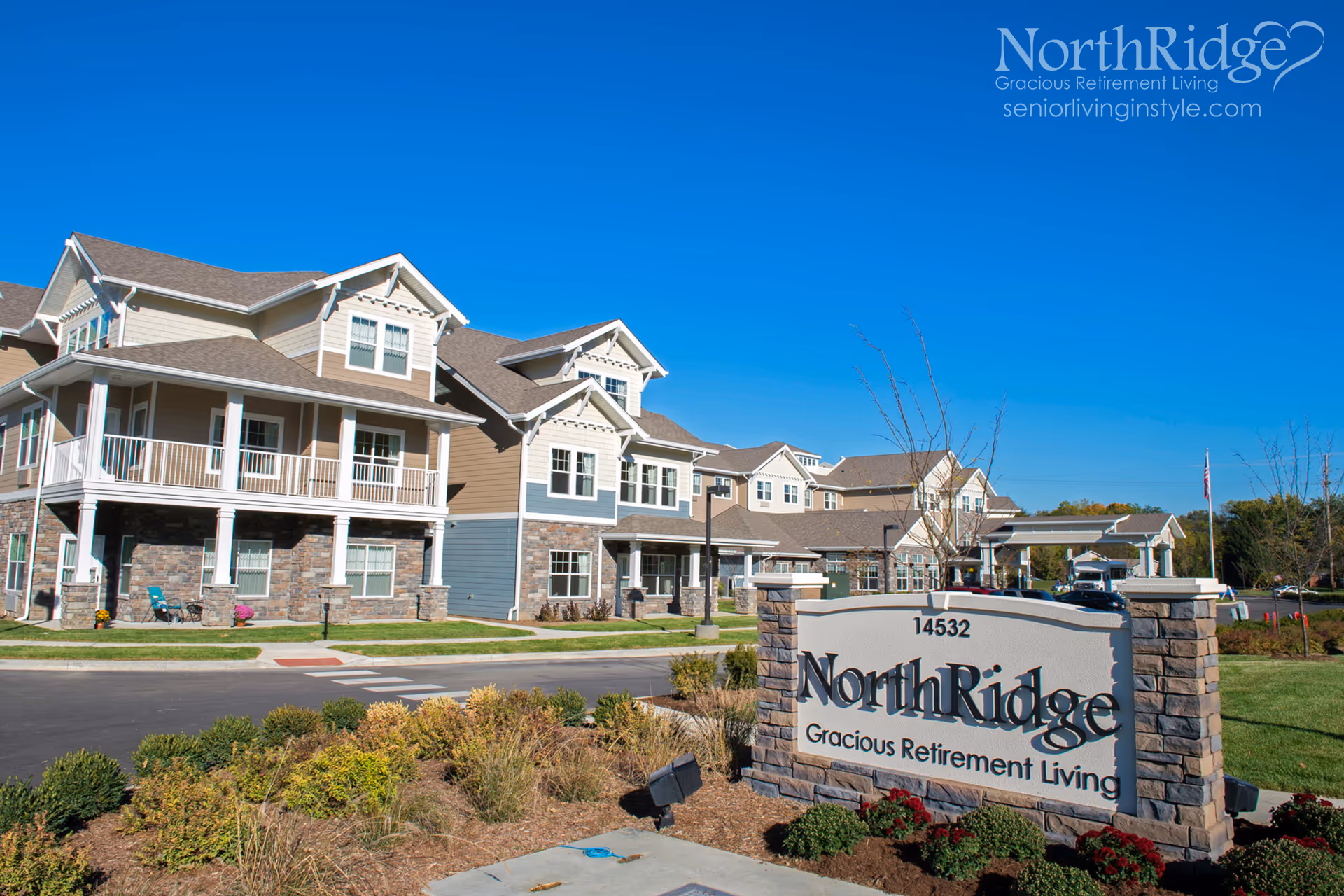 Exterior view of NorthRidge senior living campus with stone sign and multi-story buildings.
