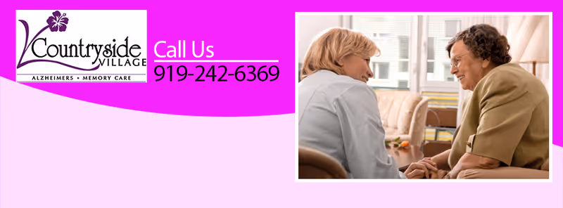 A caregiver and a senior woman engage in a warm conversation in a cozy living area.