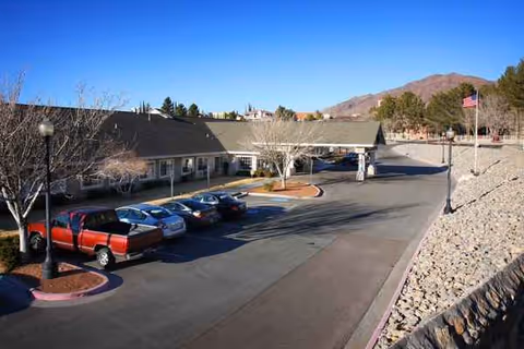 The SunRidge at Desert Springs exterior features a parking lot and arid landscaping.