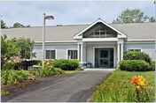 Front exterior of Pine Point Center with a paved driveway, walkway, and landscaped entrance.