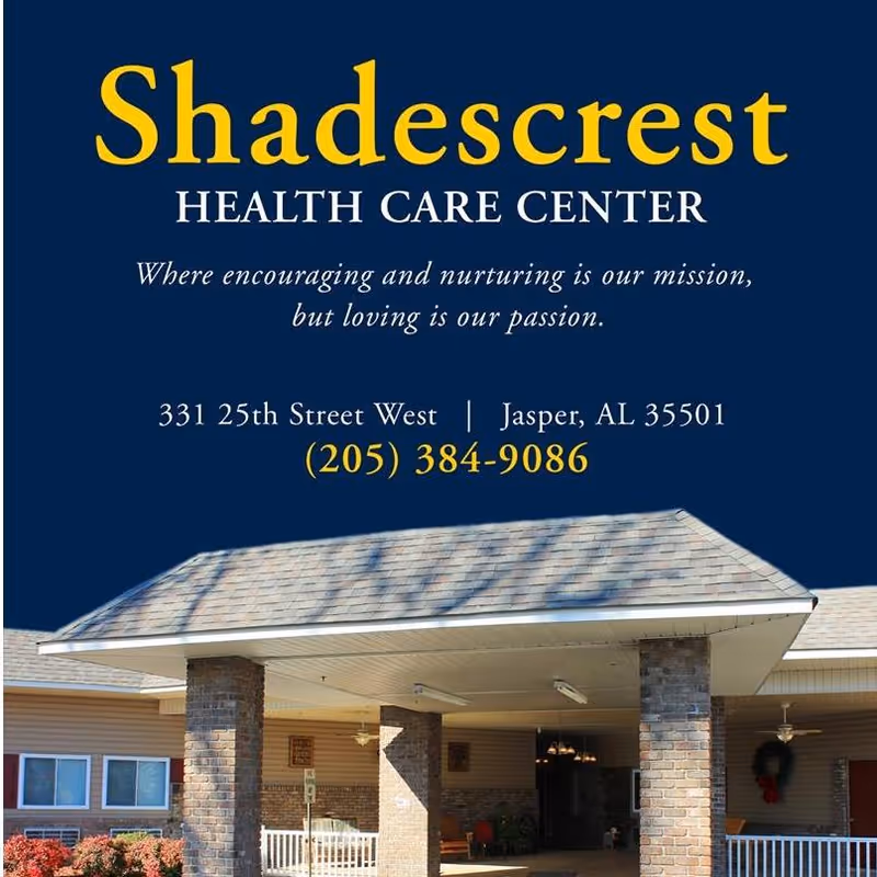 Entrance of Shadescrest Health Care Center showing a covered drop-off area with brick pillars and part of the building exterior under a clear sky.