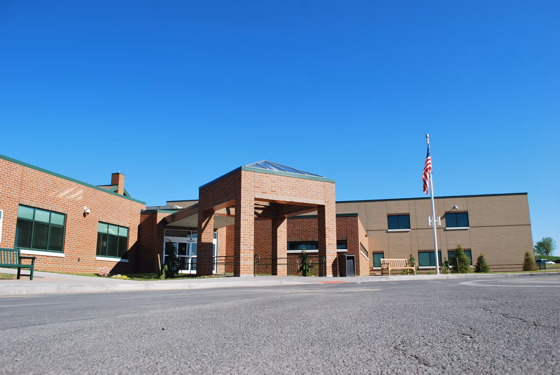 Exterior view of MVHS Rehabilitation & Nursing Center with a clear sky.
