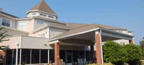 Facade of Brookdale Lake Mary senior living facility featuring a covered entrance and manicured landscaping.