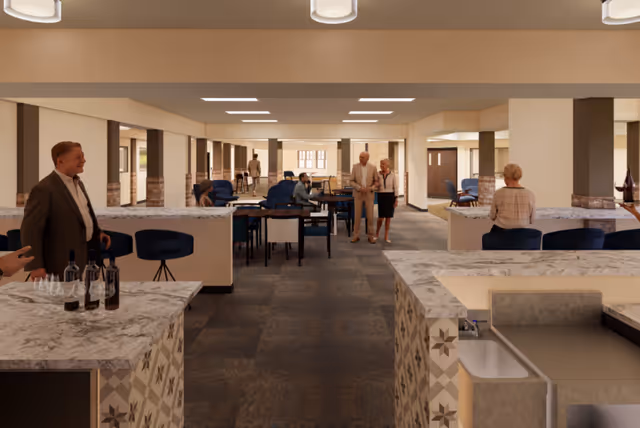 A spacious senior living common area with multiple seating arrangements including tables and chairs. Several elderly people are seen socializing and walking around. The room features marble countertops, modern lighting, and a warm color palette.