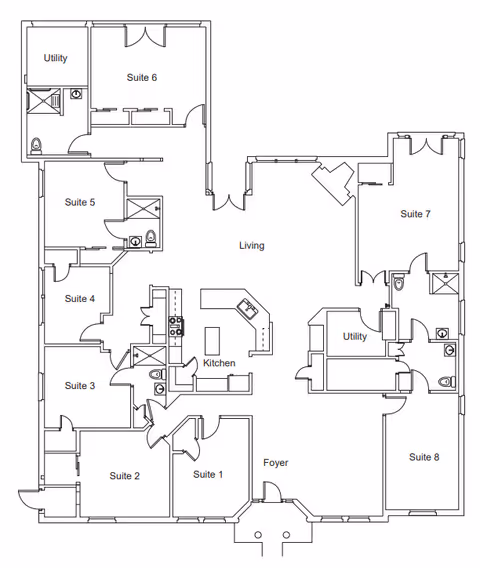 Architectural floor plan of Silver Leaf Assisted Living & Memory Care facility showing eight suites, two utility rooms, a kitchen, living area, and foyer with labeled rooms and bathroom locations.