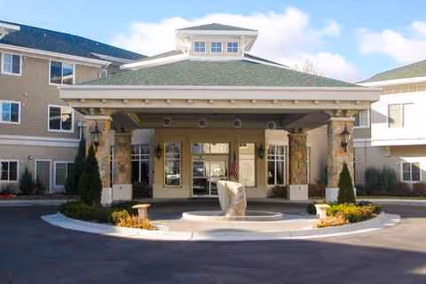 Exterior view of Fairwinds - Sand Creek entrance with porte-cochère and fountain.