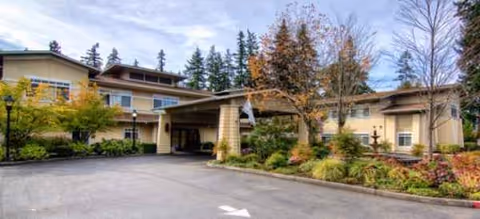 Sunrise of Redmond senior living building exterior with covered entrance and landscaped driveway