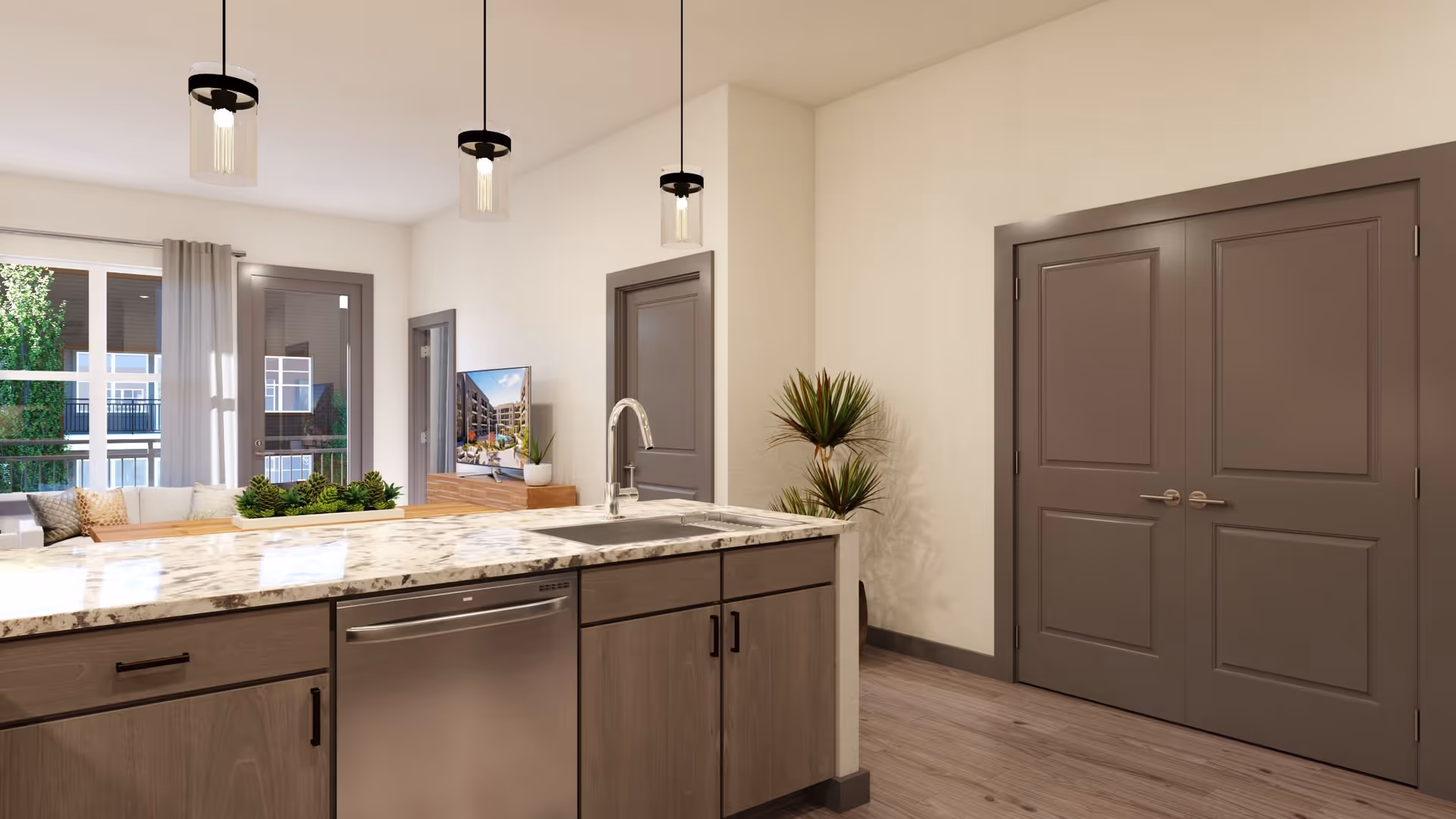 Modern kitchen area with a marble countertop island featuring a sink and dishwasher. Three pendant lights hang above the island. In the background, there is a living room with a TV on a wooden stand, a sofa with cushions, large windows, and a door leading outside. A potted plant is placed near a set of double doors.