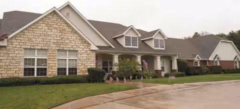 Front exterior view of Brookdale Weatherford senior living facility with manicured lawn.