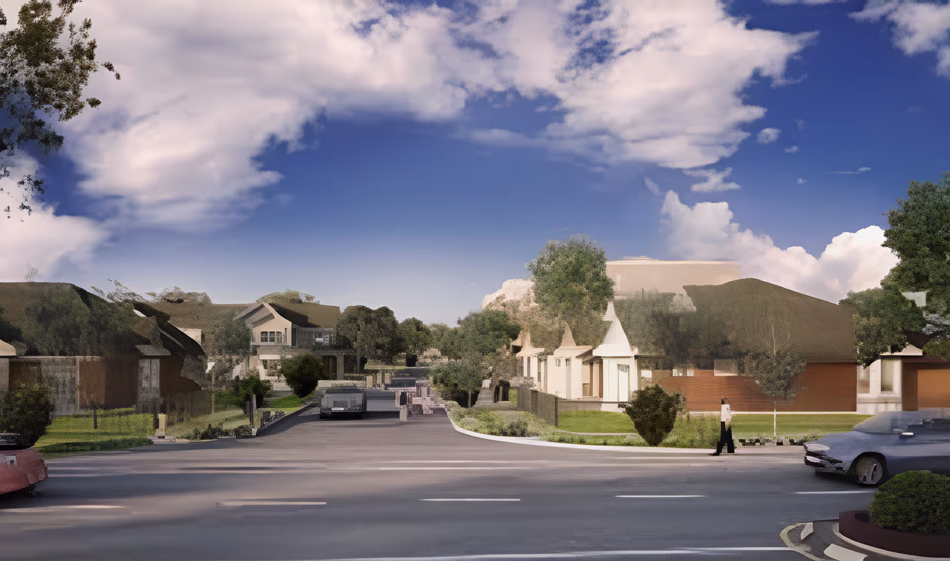 Street-level view of a senior living community showing single-story residences, landscaping, parked cars and a partly cloudy sky.
