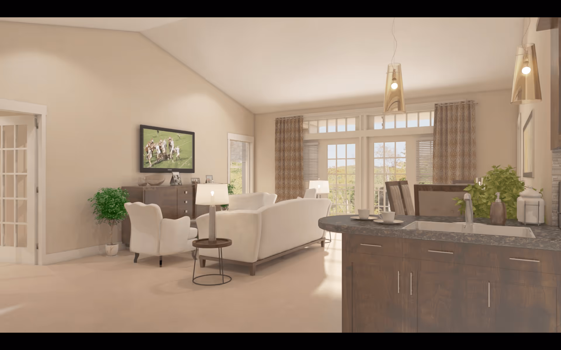 A bright and spacious living room with beige walls and carpet. The room features a white sofa and armchair facing a wall-mounted TV showing a football game. There is a wooden sideboard with framed photos and decorative items, a small round side table with a lamp, and large windows with patterned curtains letting in natural light. In the foreground, there is a kitchen island with a sink, two cups on saucers, and pendant lights hanging above.