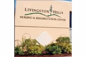 Stone entrance sign reading 'Livingston Hills Nursing & Rehabilitation Center' surrounded by landscaping.