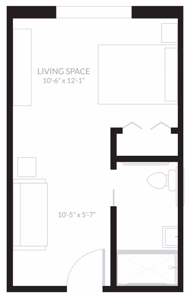 Floor plan layout showing a living space measuring 10 feet 6 inches by 12 feet 1 inch, with a separate bathroom area including a toilet and shower.