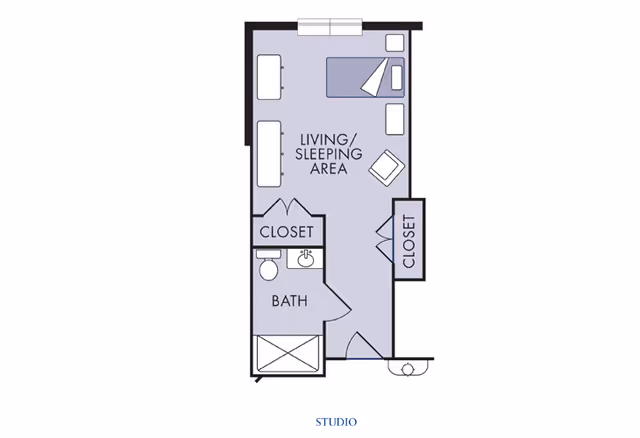 Floor plan of a studio apartment showing a living/sleeping area with a bed, chair, and furniture, two closets, and a bathroom with a toilet, sink, and shower.