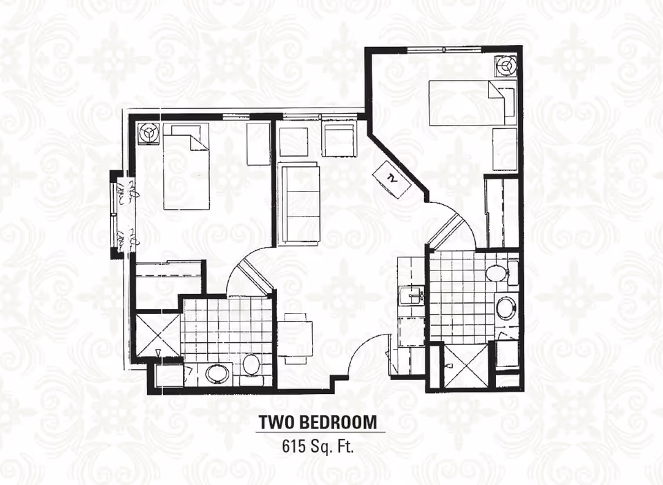 Architectural floor plan of a two-bedroom assisted living unit measuring 615 square feet, showing layout with two bedrooms, two bathrooms, a living area, and a kitchen.