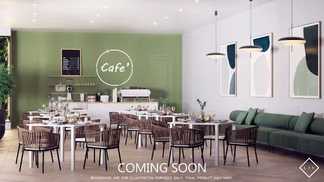 A modern cafe interior with white tables and brown woven chairs arranged neatly. The back wall is painted green with a white neon sign that reads 'Cafe'. There is a counter with a coffee machine and shelves holding cups and other items. On the right side, there is a green cushioned bench along the wall with three abstract art pieces hanging above it. Pendant lights hang from the ceiling, illuminating the space. The floor is light wood, and the overall atmosphere is clean and inviting.