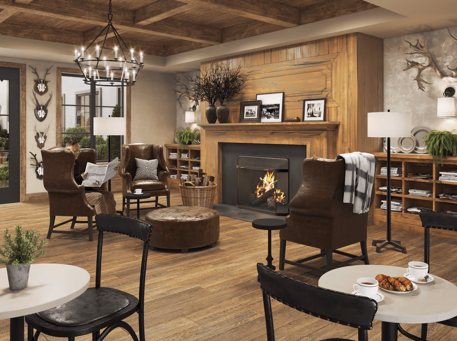 Cozy communal living room with leather armchairs around a lit fireplace, round tables with coffee and pastries, and warm wooden decor.