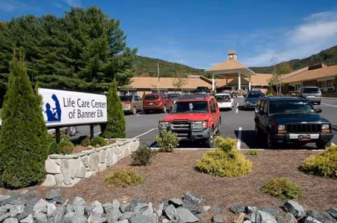 Front exterior of Life Care Center of Banner Elk with a parking lot and landscaped entry