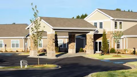 Patewood Post-Acute facility exterior with a covered entrance and stone pillars.
