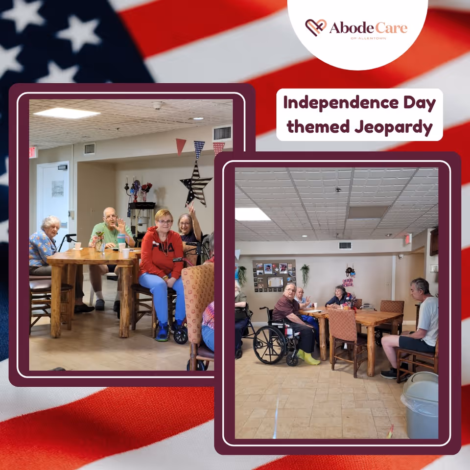 Two photos showing elderly residents sitting around wooden tables in a common room decorated with patriotic items. The residents appear engaged in an Independence Day themed Jeopardy game. The room has a tiled ceiling, beige walls, and various chairs including wheelchairs. There is a large star decoration on the wall and some small flags hanging.