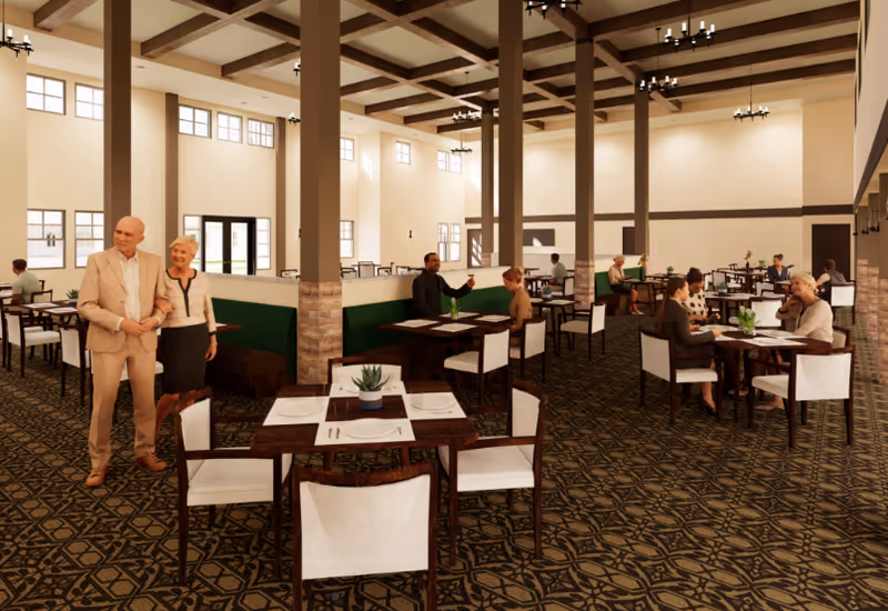 Spacious dining room with high ceilings, columns, multiple tables, and residents seated and conversing.