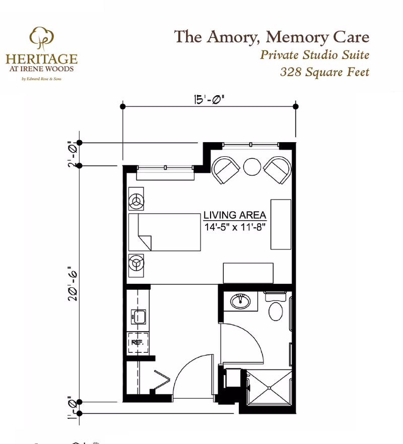 Architectural floor plan of The Amory, Memory Care private studio suite at Heritage at Irene Woods, showing a 328 square feet layout with a living area measuring 14 feet 5 inches by 11 feet 8 inches, including a bed, two chairs with a small table, a kitchenette with a sink and refrigerator, and a bathroom with a sink, toilet, and shower.