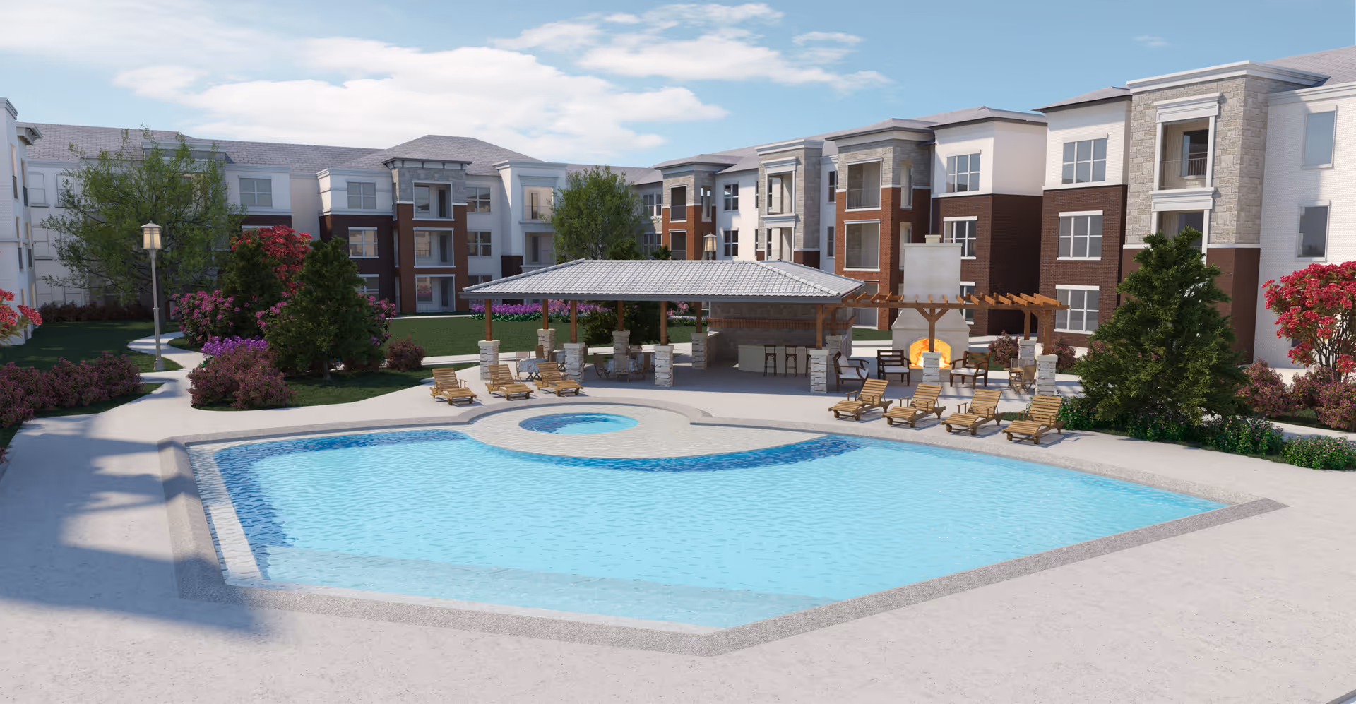 Outdoor swimming pool area at Ariel Pointe of Sachse Senior Living with lounge chairs around the pool, a covered pavilion with seating, a fireplace, and landscaped greenery including trees and flowering bushes. The senior living facility building with multiple floors and balconies is visible in the background under a partly cloudy sky.
