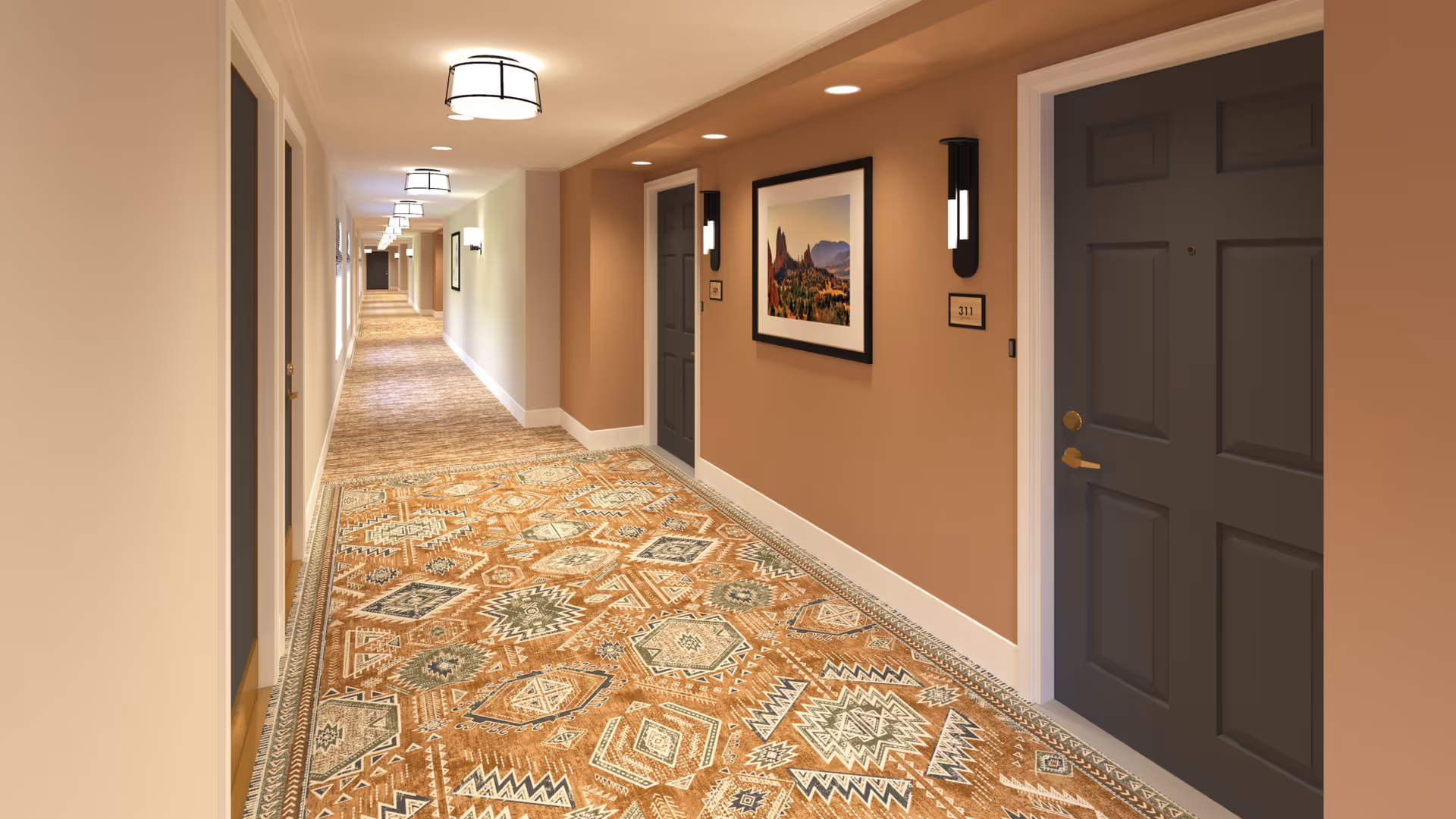 Carpeted interior hallway with numbered apartment doors, wall sconces, and framed artwork.