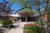 Front exterior of Medilodge of Sault Ste. Marie with walkway and landscaping.