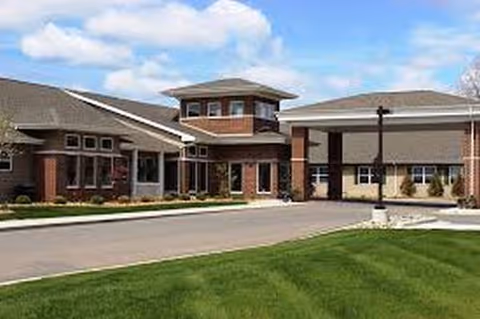 Exterior view of Traditions of Saginaw Main Campus building with brick facade and manicured lawn.