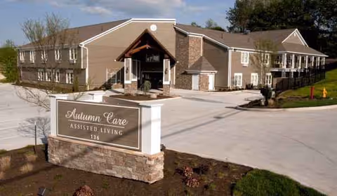 Exterior view of Autumn Care West assisted living facility with front entrance and sign.