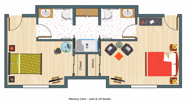 Floor plan of a memory care Jack & Jill studio apartment with two bedrooms, each with a bed, nightstand, and desk. The bedrooms share a central bathroom with two sinks and a shower in the middle, and closets are located between the bedrooms and bathroom.
