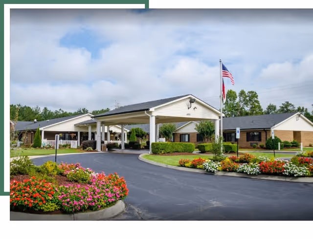 Exterior view of Southpoint Rehabilitation and Healthcare Center entrance with landscaped driveway.