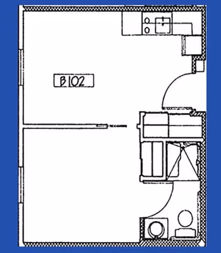 Architectural floor plan of a small apartment unit labeled B102, showing a combined living and kitchen area, a bathroom with a toilet and sink, and a closet space.