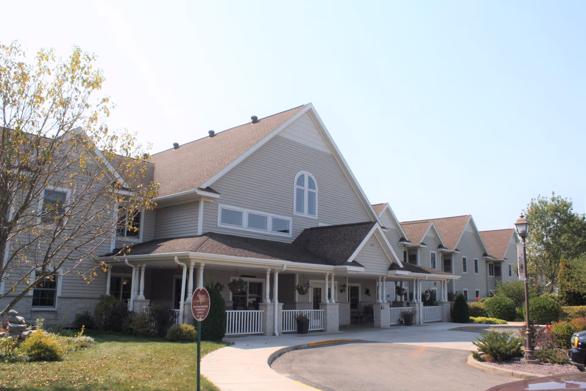 HeatherWood assisted living facility with a covered front porch and landscaped entrance
