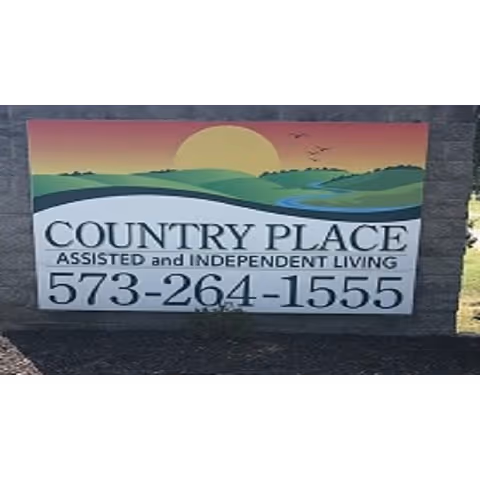 A sign for Country Place Assisted and Independent Living with a phone number 573-264-1555. The sign features a graphic of a sunrise or sunset over rolling green hills with a river and birds flying in the sky.