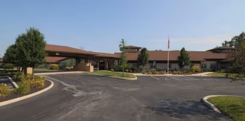 Exterior view of Altercare Hilliard showing a single-story building with driveway and parking.