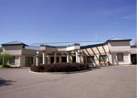 Exterior view of Village Crest Center front entrance with a circular driveway.