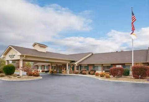 Front exterior of Life Care Center of Jefferson City with entrance and flagpole.