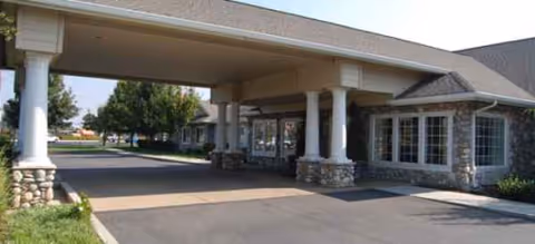 Entrance to a Brookdale senior living facility with a covered drop-off area.