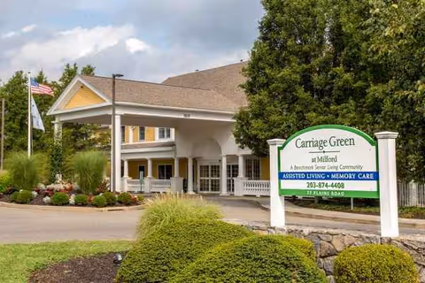 Exterior view of Carriage Green at Milford with its entrance and sign.