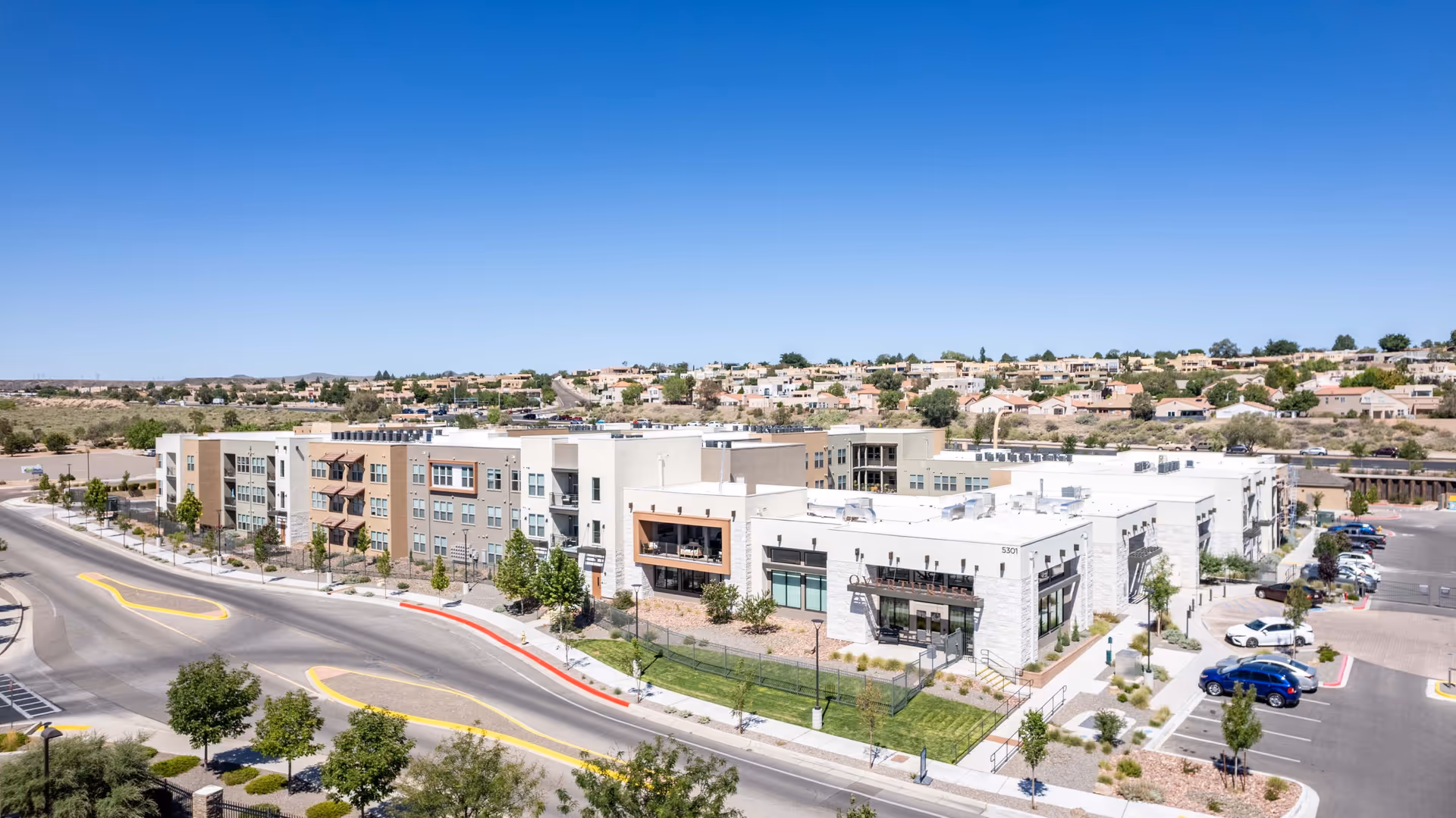 Aerial view of the Overture Andalucia senior living complex and surrounding neighborhood under a clear blue sky.