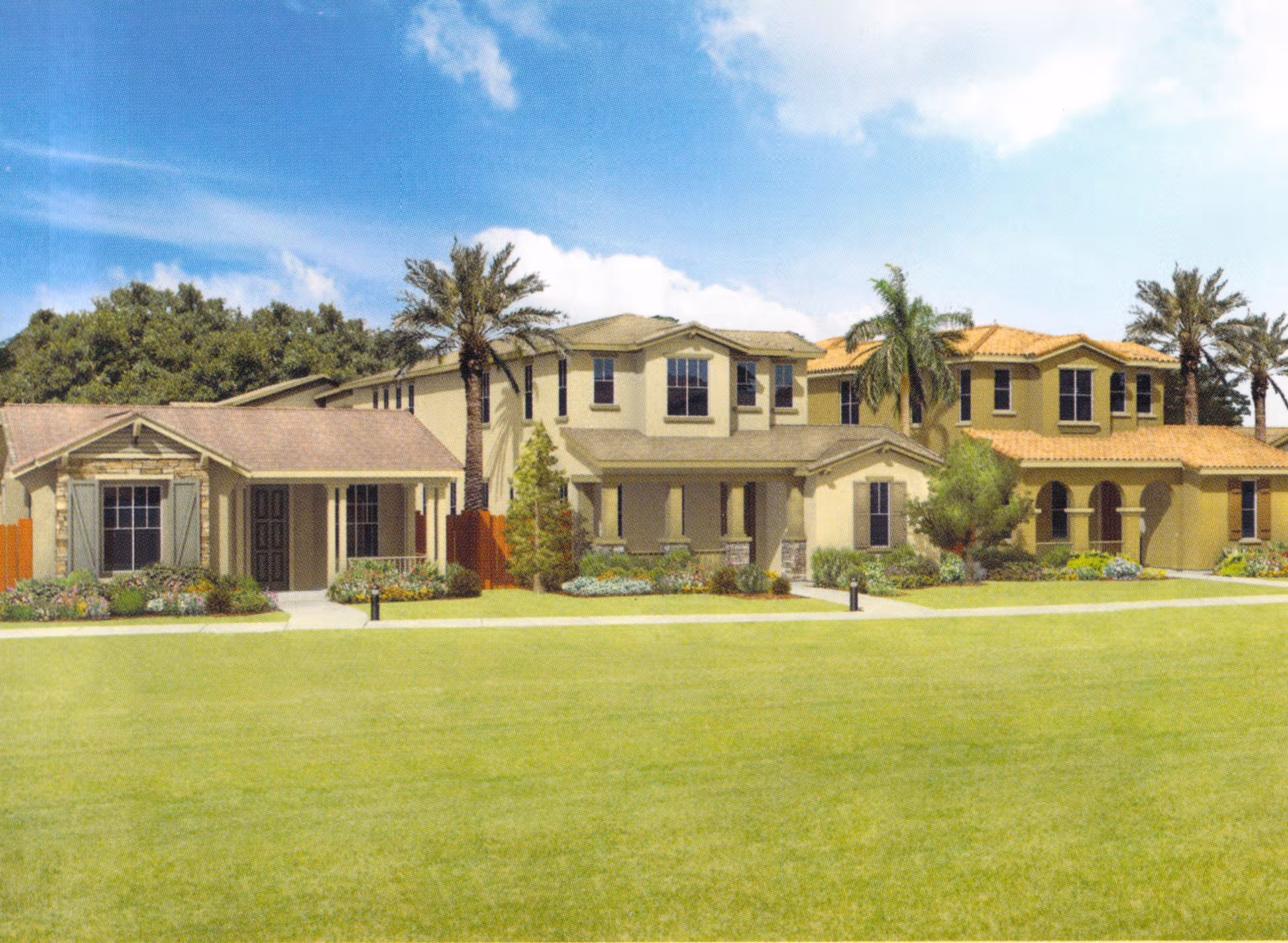 Exterior view of a senior living facility named Peppertree, showing multiple connected buildings with beige and tan walls, tiled roofs, palm trees, and well-maintained green lawns under a blue sky with some clouds.