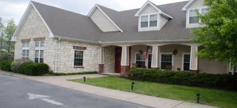 Exterior view of Brookdale Goodlettsville senior living facility with lawn and entrance.