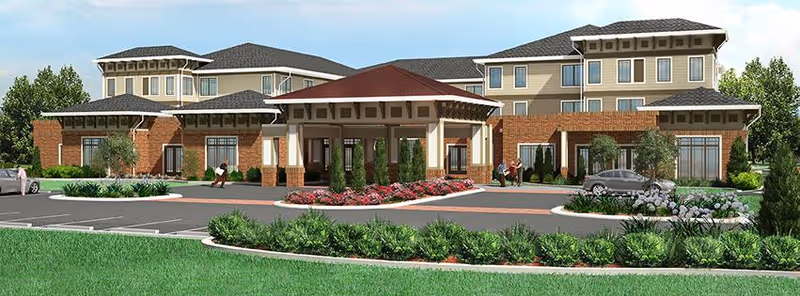Front exterior view of Summer Vista Assisted Living facility showing a large building with multiple windows, a covered entrance with columns, landscaped greenery, and a parking area with a few people walking nearby.