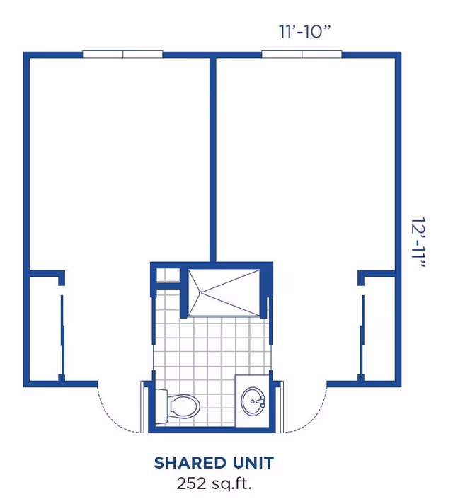 Floor plan of a shared unit at The Lodge Assisted Living And Memory Care Community, showing two separate rooms connected by a central bathroom with a toilet, sink, and shower. The total area is 252 square feet.